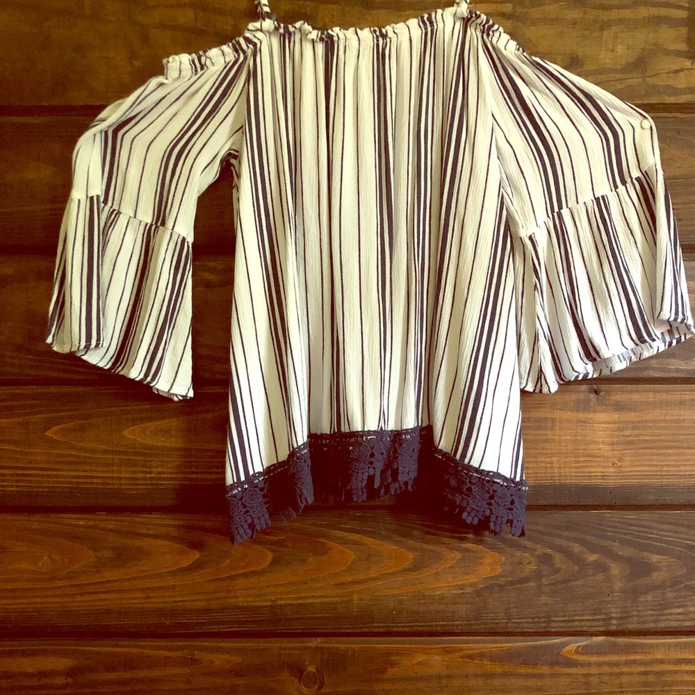 Beautiful striped shirt with flared sleeves.